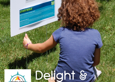 Explore MORE promotion showing child reading storywalk sign
